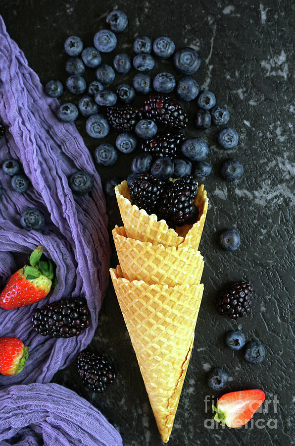 Summer blueberries and blackberries in ice cream waffle cone #1 Photograph by Milleflore Images