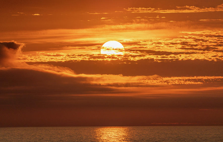 Sun Dropping into the Sea #1 Photograph by Tommy Farnsworth