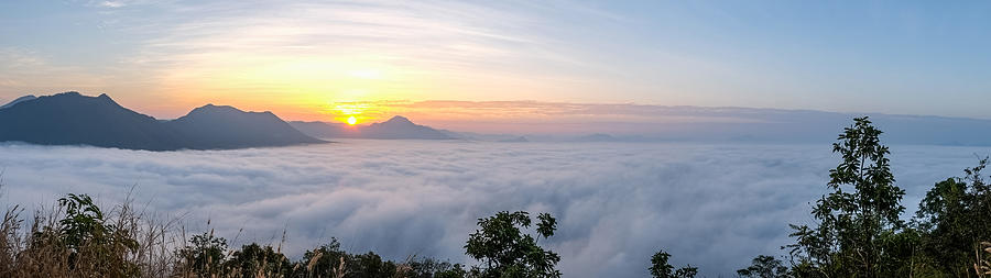 Sunrise with sea of fog over Phu Thok Mountain at Chiang Khan, Thailand #1 Photograph by Lifeispixels