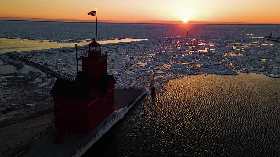 Sunset in winter of the Holland Michigan Lighthouse along Lake Michigan #1 Photograph by Eldon McGraw