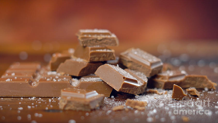 Sweet and salty chocolate snacks, salted caramel bar, macro close up #1 Photograph by Milleflore Images