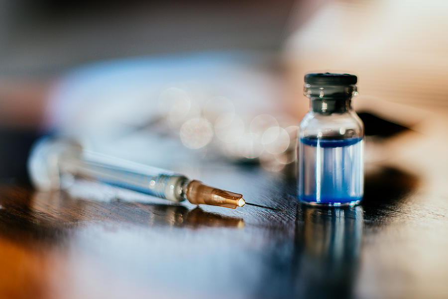 Syringe and a vial. #1 Photograph by Guido Mieth