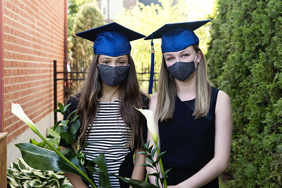 Teenage girls graduation from primary school portrait with protective mask. #1 Photograph by Martinedoucet