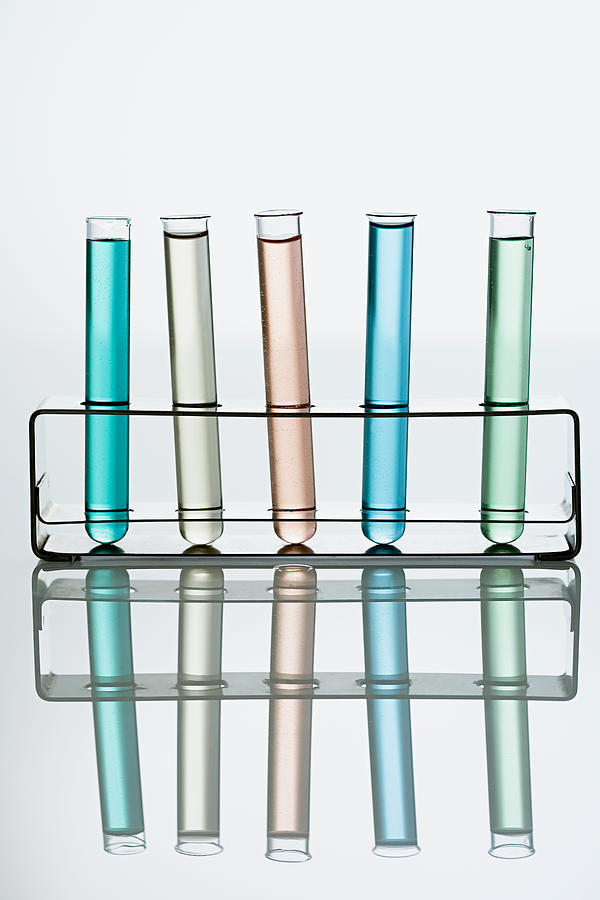 Test tubes in a holder #1 Photograph by Image Source