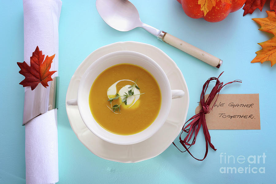 Thanksgiving table setting with pumpkin soup. #1 Photograph by Milleflore Images