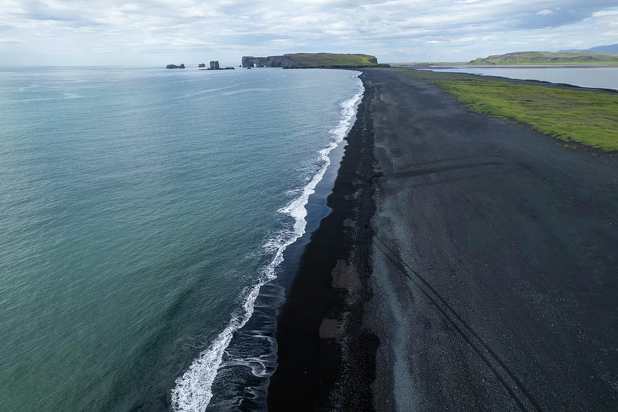 The black beach in Iceland #1 Photograph by Pietro Ebner