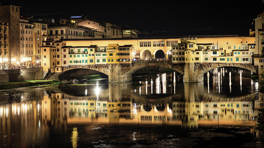 The Ponte Vecchio at night #1 Photograph by Alexey Stiop