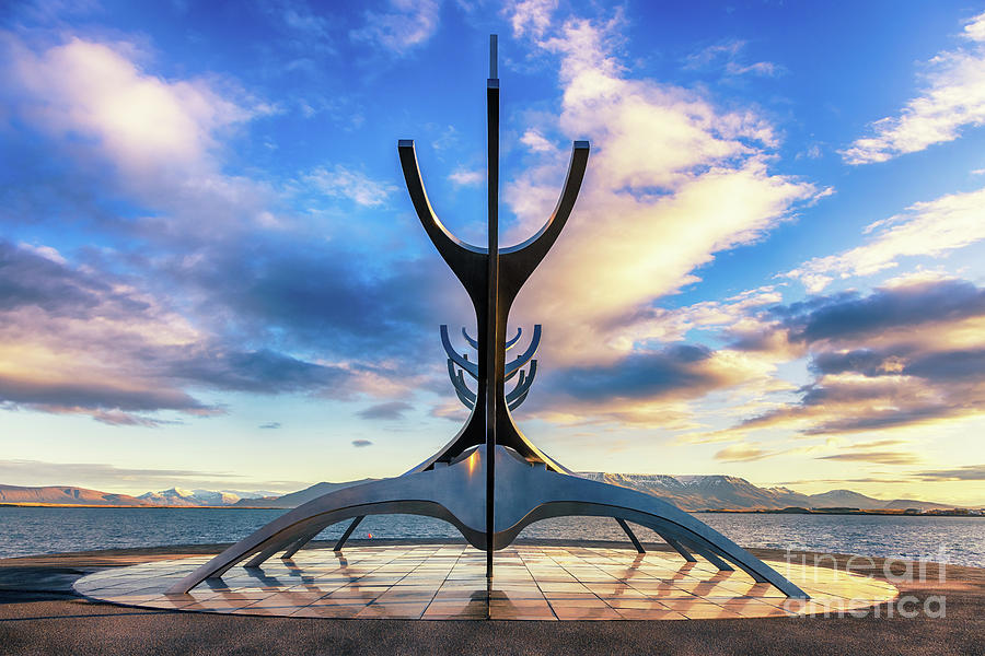 The Sun Voyager, a modern sculpture by Jon Gunnar Arnason, of a viking ship. Sunrise in Reykjavik, Iceland. #1 Photograph by Jane Rix