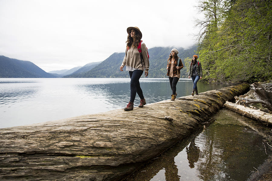 Three girls on a day hike. #1 Photograph by Jordan Siemens
