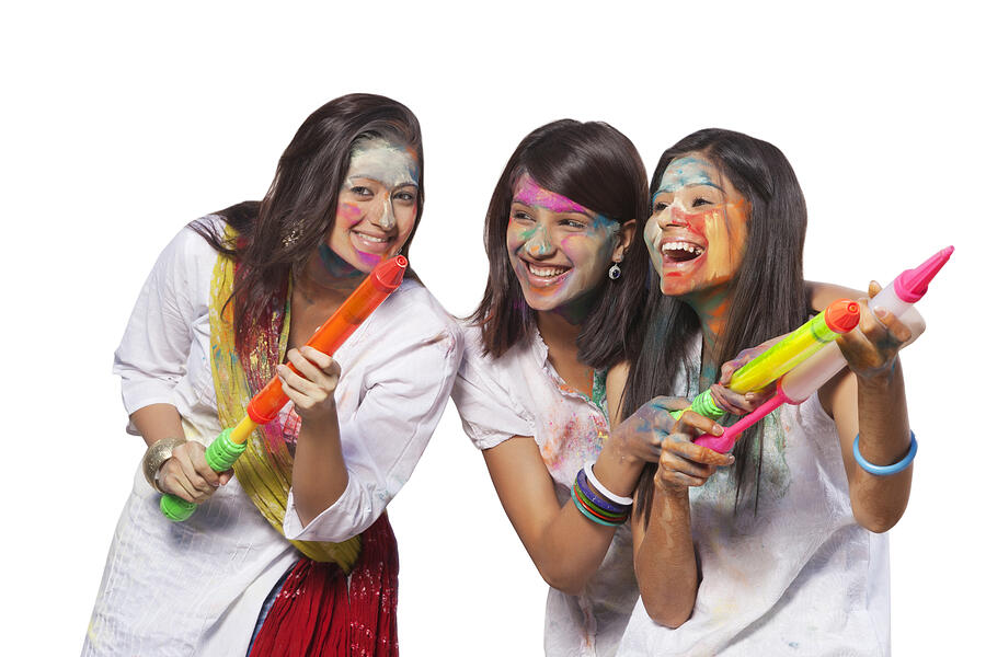 Three women playing holi #1 Photograph by IndiaPix/IndiaPicture