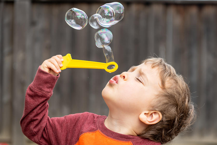 Three Years Old Child Boy Blowing Bubbles Photograph by Juanmonino