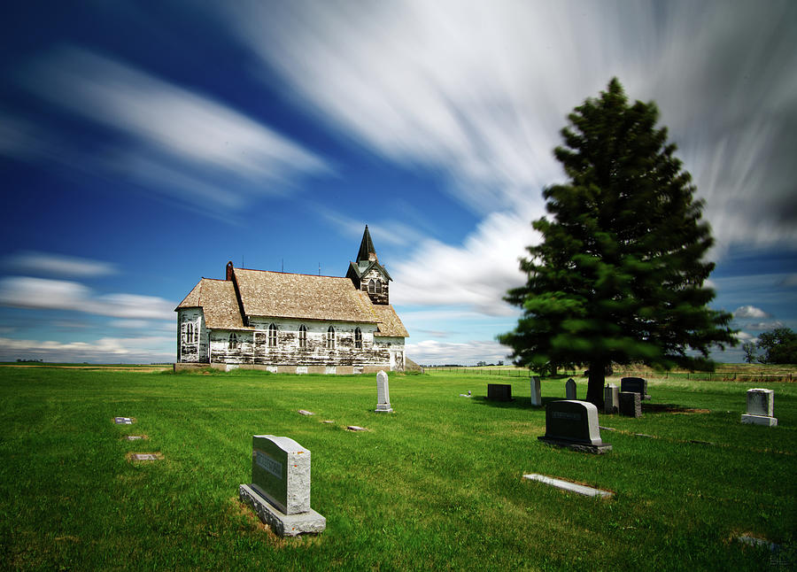 Time Flying By - Clouds racing by above the Big Coulee Lutheran Church #1 Photograph by Peter Herman