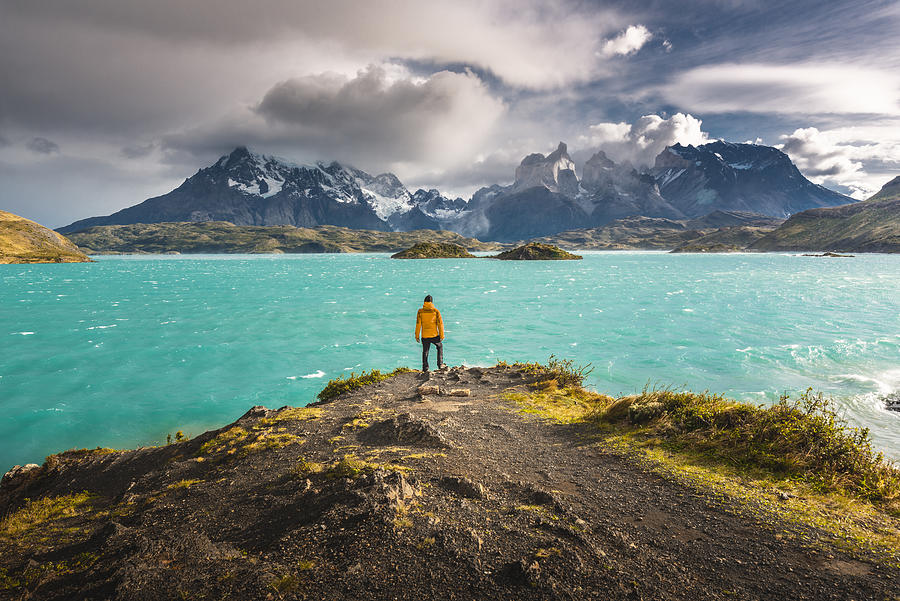 Tourist admiring the Cordillera Paine in Torres del Paine National Park, Chile #1 Photograph by © Marco Bottigelli