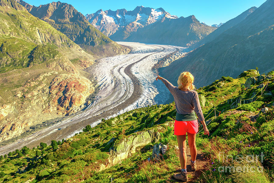 Tourist woman at Alpine Glacier #1 Photograph by Benny Marty