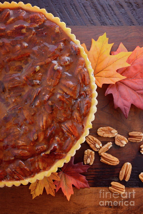 Thanksgiving Photograph - Traditional Happy Thanksgiving Pecan Pie in rustic setting. #1 by Milleflore Images