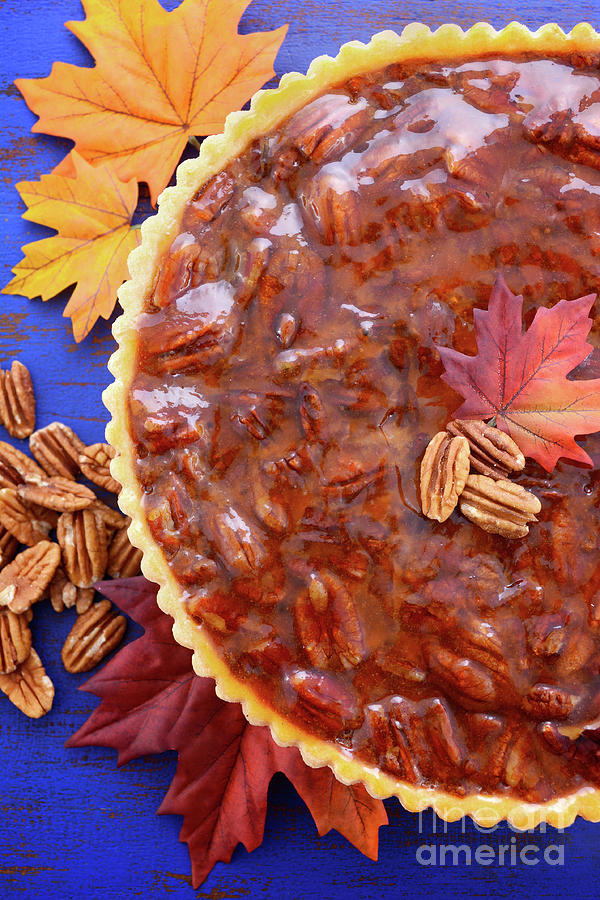 Traditional Thanksgiving Pecan Pie on Dark Blue Wood. #1 Photograph by Milleflore Images