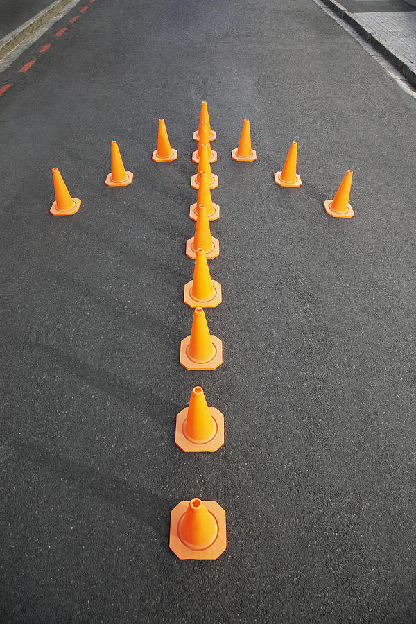 Traffic cones in arrow-shape #1 Photograph by Martin Barraud