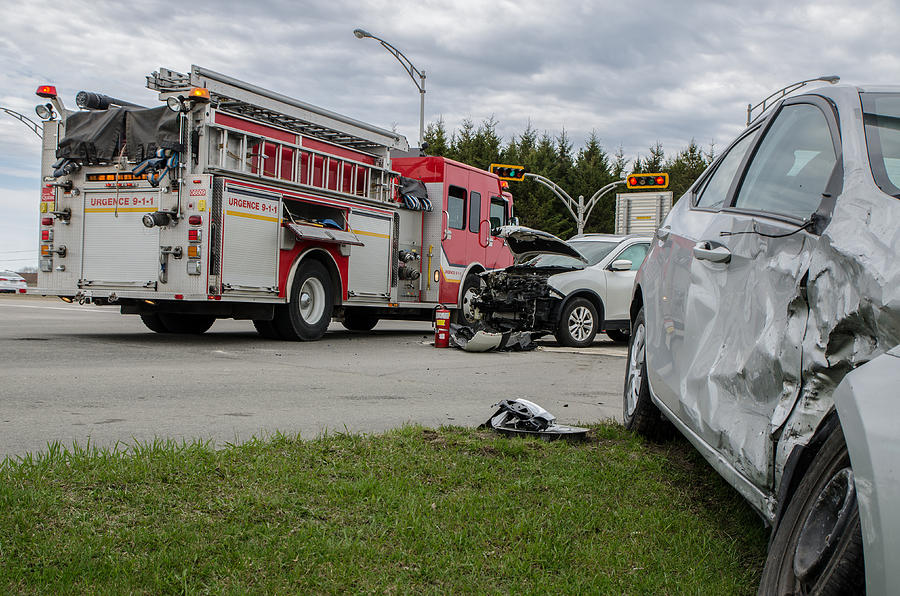 Two cars crashed in accident with firetruck behind #1 Photograph by Marc Dufresne