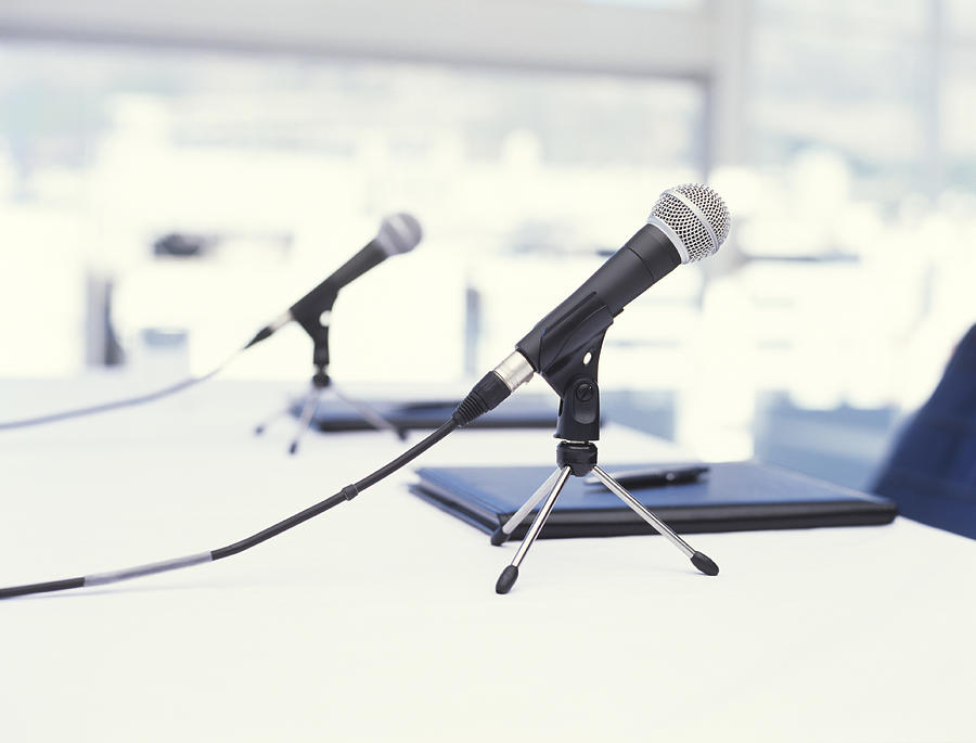 Two microphones on table, close up #1 Photograph by George Doyle