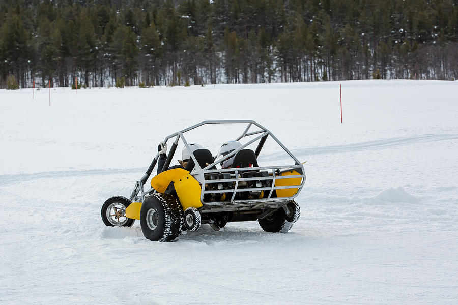 Two People Drive a Snow Buggy Around an Obstacle Course in Rural Norway, Wintertime #1 Photograph by Morten Falch Sortland