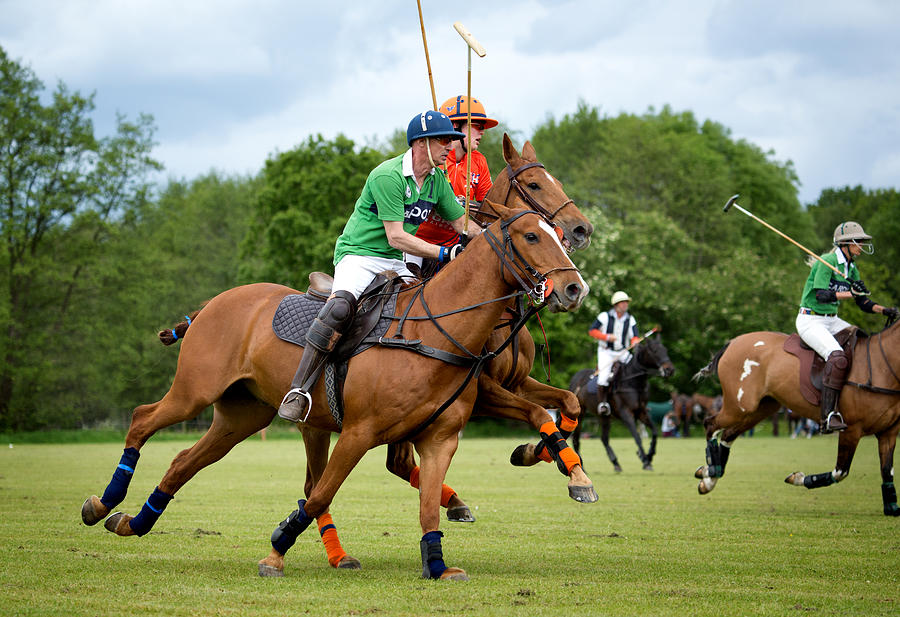 Two polo teams challenging for the ball #1 Photograph by Lorado