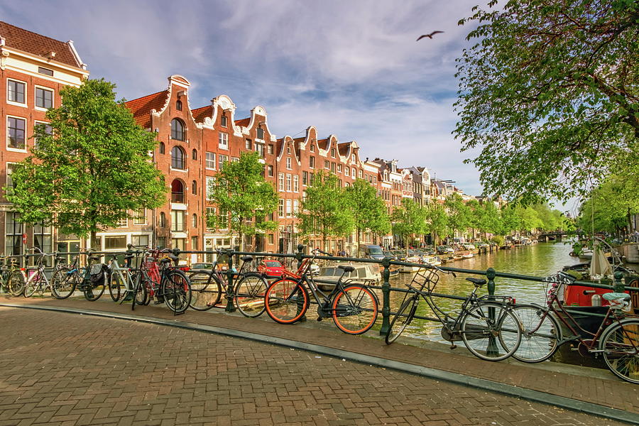Typical buildings, canal and bikes in Amsterdam, Netherlands #1 Photograph by Elenarts - Elena Duvernay photo