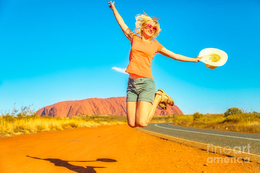 Uluru Woman Jumping Photograph