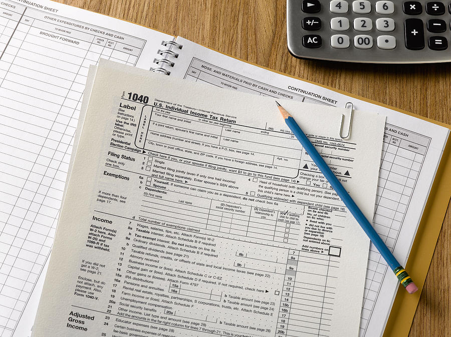 US tax forms #1 Photograph by Jeffrey Hamilton