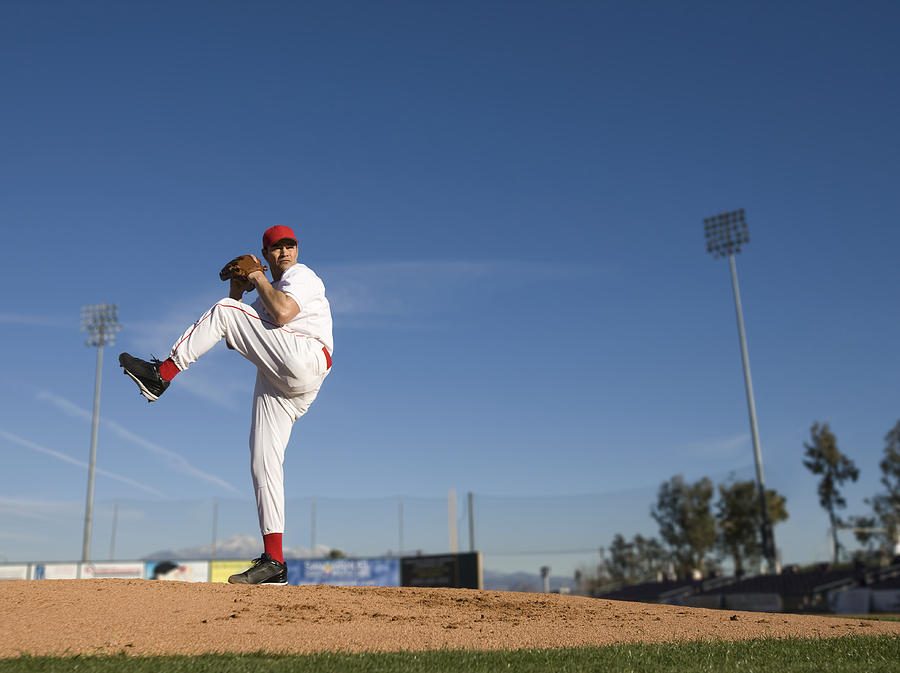 USA, California, San Bernardino, baseball pitcher throwing pitch, outdoors #1 Photograph by Donald Miralle