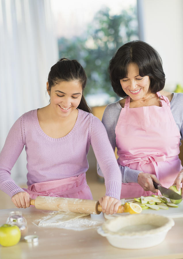 USA, New Jersey, Jersey City, Grandmother and granddaughter (16-17) baking together #1 Photograph by Tetra Images