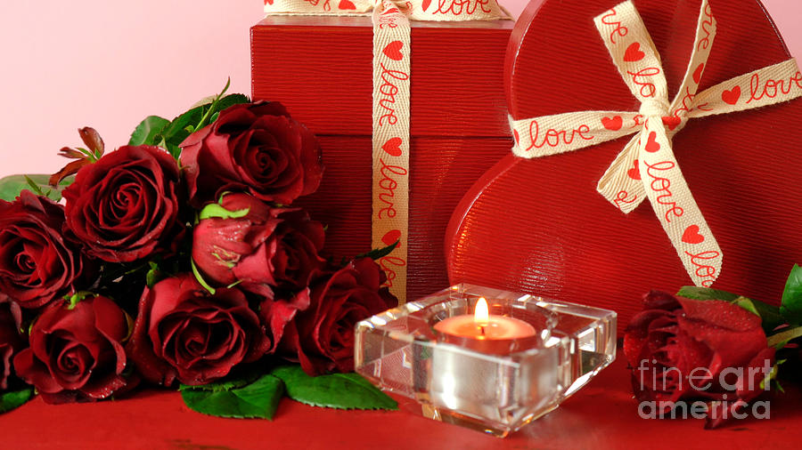 Valentines Day gifts and red roses on red wood table background. #1 Photograph by Milleflore Images