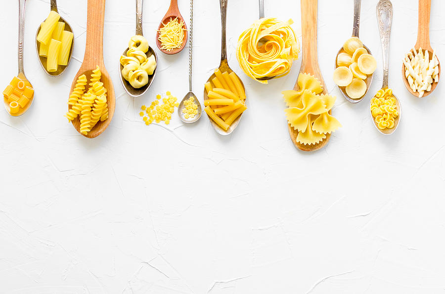 Variety of types and shapes of Italian pasta #1 Photograph by NelliSyr
