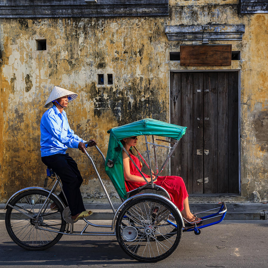 Vietnamese cycle rickshaw in old town in Hoi An city, Vietnam #1 Photograph by Hadynyah