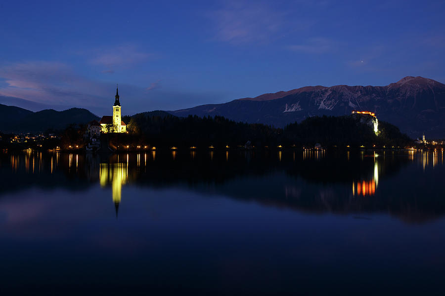 View across Lake Bled at night #1 Photograph by Ian Middleton