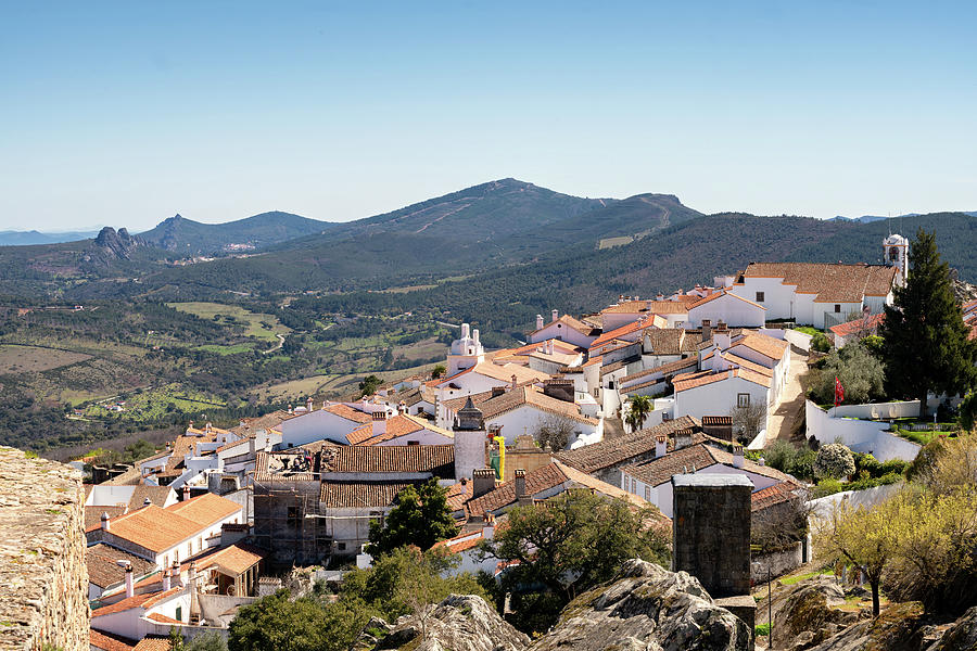 View of Marvao village with beautiful houses and church with rocky ...