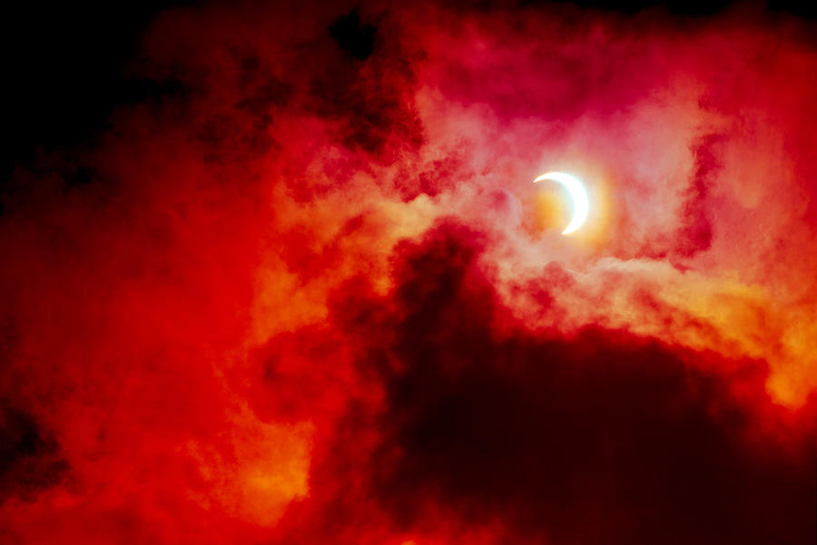View of partial annular solar eclipse in Kuala Lumpur with dramatic colour. #1 Photograph by Shaifulzamri