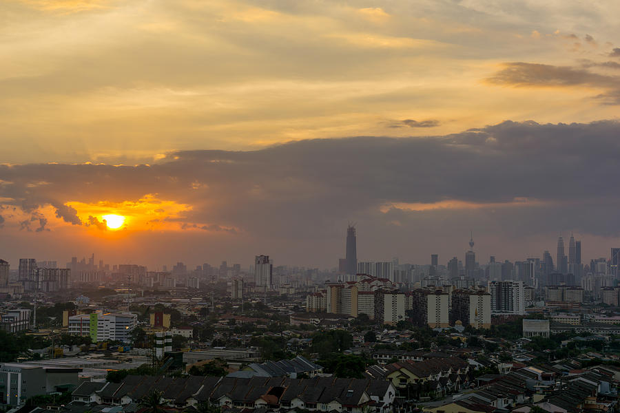 View of sunset at downtown Kuala Lumpur. Its modern skyline is dominated by the 451m tall Petronas Twin Towers, pair of of glass-and-steel-clad skyscraper. #1 Photograph by Shaifulzamri