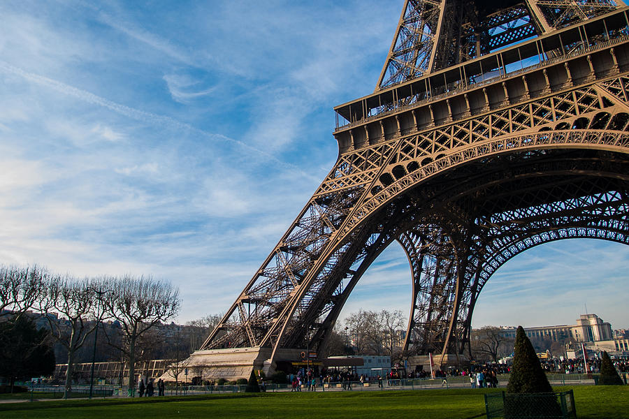 View of the base of the Eiffel Tower with massive feet planted in the ground #1 Photograph by Michael Godek