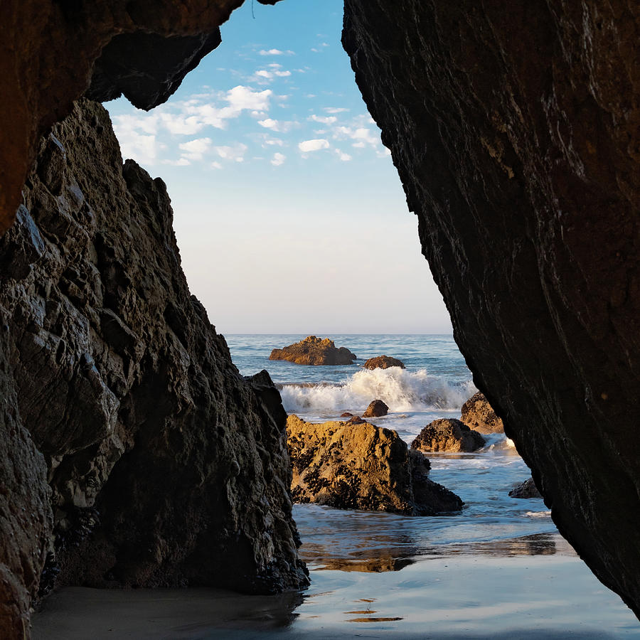 Ocean View through the Rocks with Crashing Waves Photograph by Matthew DeGrushe