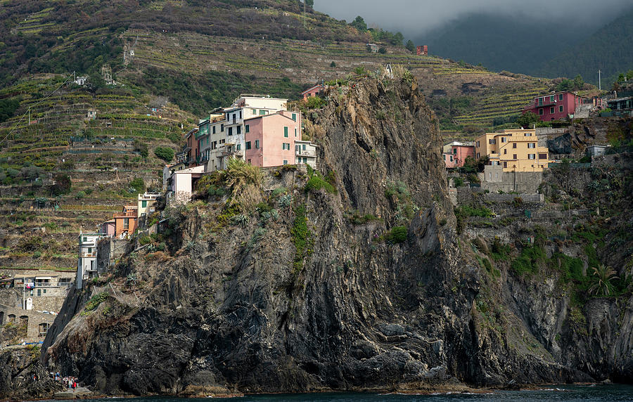 Village of Manarola with colourful houses at the edge of the cliff Riomaggiore, Cinque Terre, Liguria, Italy #1 Photograph by Michalakis Ppalis