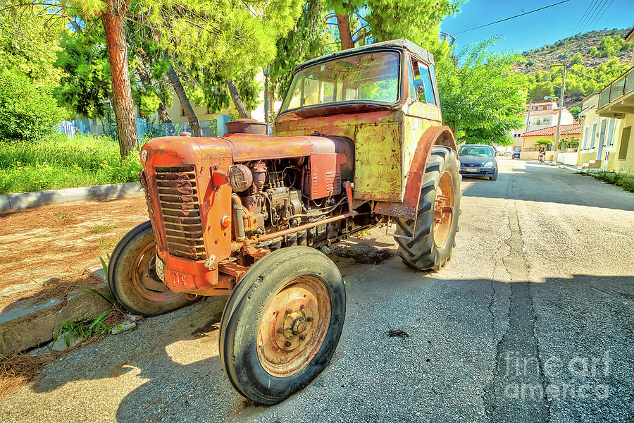 Vintage tractor abandoned #1 Photograph by Benny Marty
