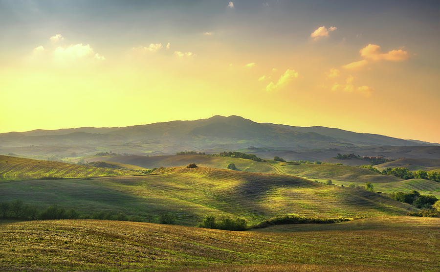 Volterra panorama, rolling hills, trees and green fields at suns #1 Photograph by Stefano Orazzini