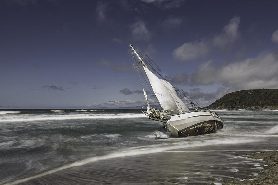 Washed Ashore Sailboat on Beach #1 Photograph by JasonDoiy