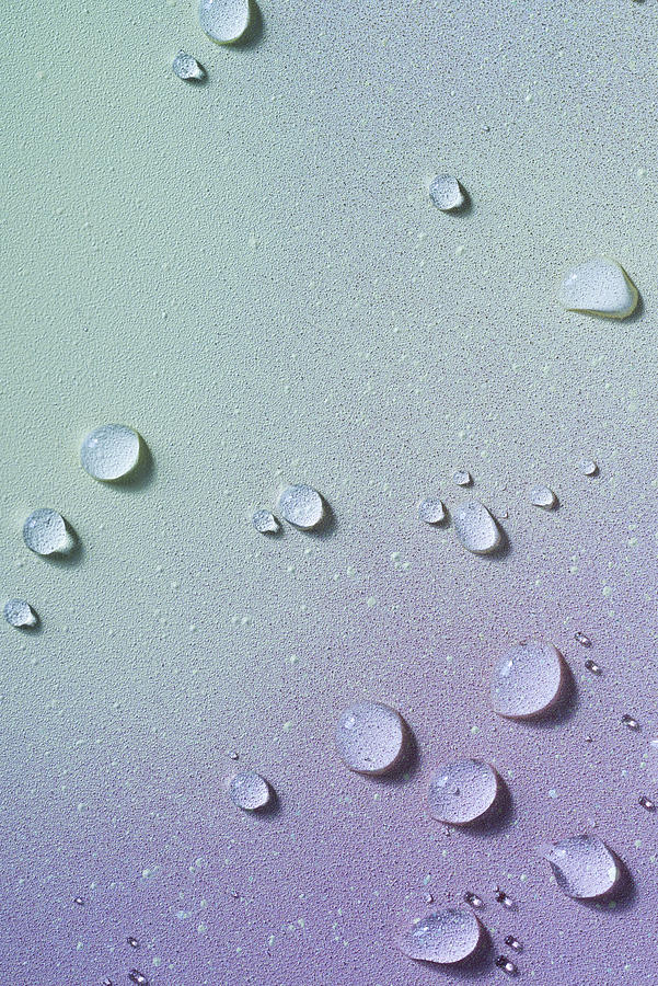 Water droplets on soft colored background Photograph by Colormos