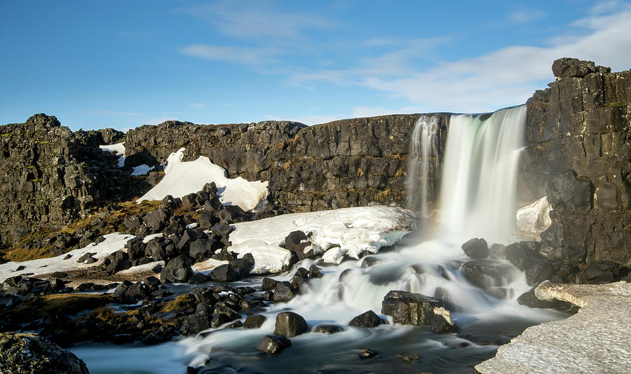 Water from waterfall splashing on a rocky river Iceland Photograph by Michalakis Ppalis