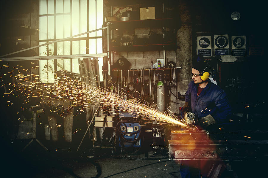 Welder cutting iron in workshop #1 Photograph by Guido Cavallini