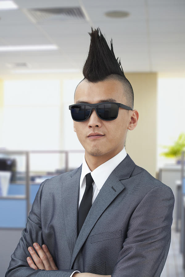 Well-dressed young man with Mohawk and sunglasses #1 Photograph by XiXinXing
