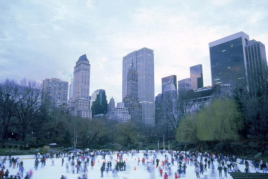 Wollman Rink ice skaters during Winter, Central Park, New York City #1 Photograph by Barry Winiker