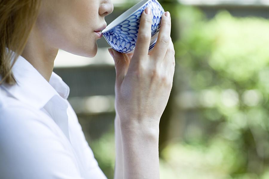 Woman drinking tea #1 Photograph by Image Source