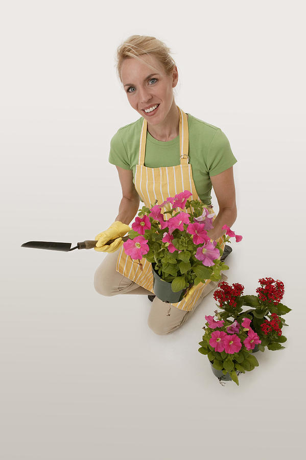 Woman gardening #1 Photograph by Comstock Images